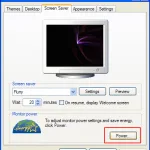 Windows XP Display Properties Screen Saver tab with the Power button highlighted