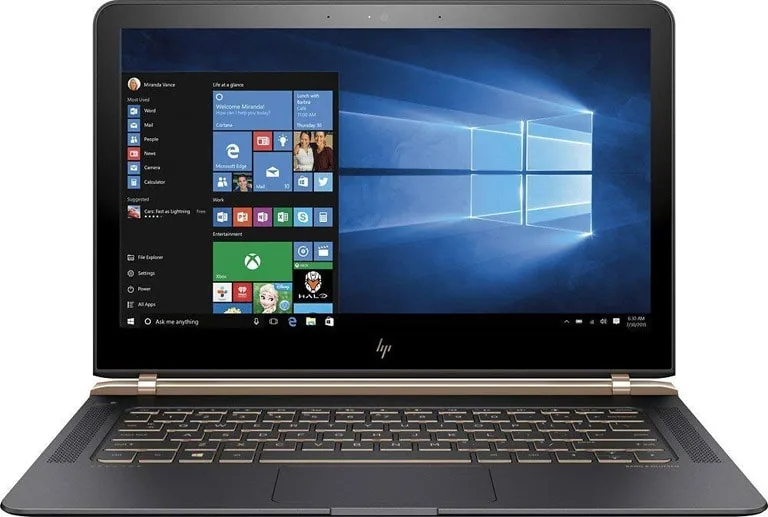 HP Spectre 13 laptop open with the Windows 10 Start menu on screen