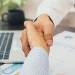 Two Businessmen Shake Hands