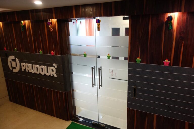 Entrance to the Prudour office with the company logo on the wall