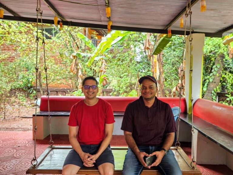 Rajesh Namase and Tushar Thakur sitting together on a swing
